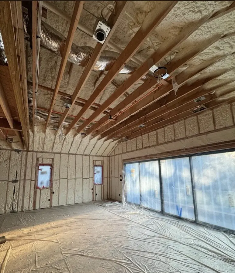 Interior walls and ceiling insulated with spray foam during new construction in Estherville