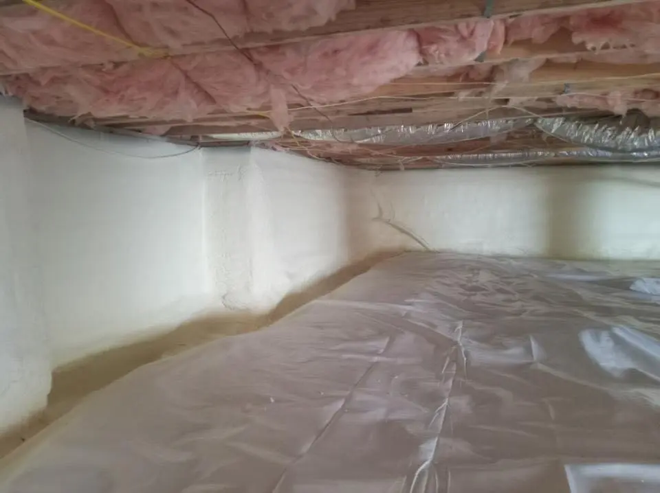 Crawl space encapsulation with closed-cell spray foam for Commercial Roof Restoration in Estherville